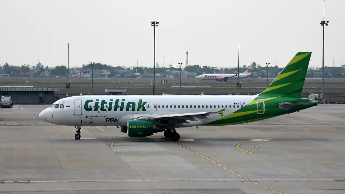 Citilink Airbus A320-214 taxiing in side profile, showing the flat wingtip fences and slim CFM56-generation engine pods of the ceo-generation A320.