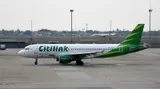 Citilink Airbus A320-214 taxiing in side profile, showing the flat wingtip fences and slim CFM56-generation engine pods of the ceo-generation A320.
