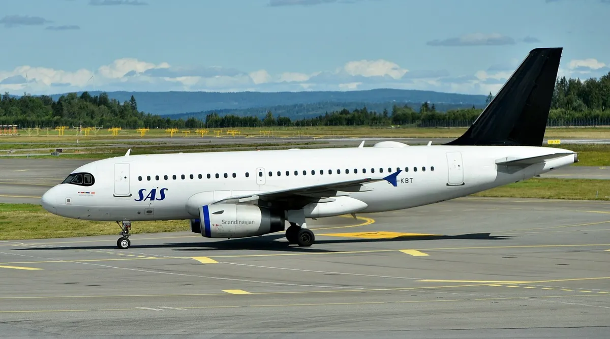 SAS Scandinavian Airlines Airbus A319-131 OY-KBT taxiing in a left-front quarter view against a clear background, showing the short, stubby body and flat wingtip fences typical of the ceo-generation A319.