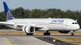 United Airlines Boeing 787-10 N12003 taxiing in side profile, showing its stretched body, raked wingtips, and saw-tooth-edged engine pods.