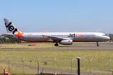 Jetstar Airways Airbus A321-231 taxiing in side profile, showing the stretched body, flat wingtip fences, and slim CFM56-generation engine pods of the ceo-generation A321.