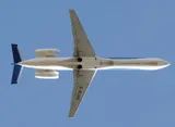bmi Regional Embraer ERJ145 seen directly from below on takeoff, showing the pencil-thin body, rear-mounted engines, and T-tail.