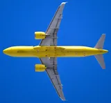 Spirit Airlines Airbus A320neo seen directly from below, showing the underside outline, engine pods, and wing shape.
